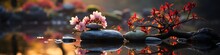 Stacked Rocks Surrounded By Pink Flowers And Red Leaves, On Water, Symbolizing Balance And Mindfulness, Created With Generative AI Technology