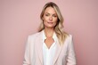 © Leon Waltz - Portrait of a beautiful blonde woman in a pink suit on a pink background
