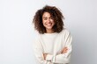 Medium shot portrait photography of a pleased Brazilian woman in her 30s wearing a cozy sweater against a white background 