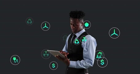 Poster - Animation of multiple digital icons over african american businessman using digital tablet