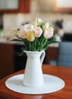Spring tulips in a vase on the table. Spring holiday, home decor.
