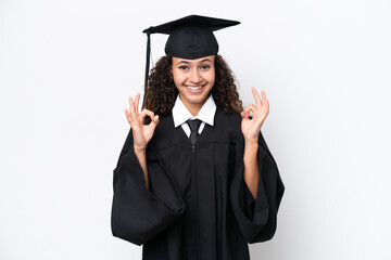 Wall Mural - Young university graduate Arab woman isolated on white background showing an ok sign with fingers