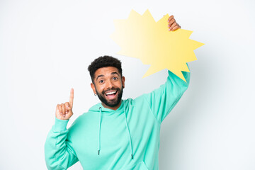 Wall Mural - Young Brazilian man isolated on white background holding an empty speech bubble with surprised expression