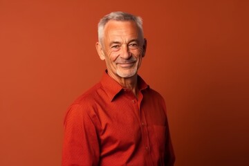 Wall Mural - Medium shot portrait photography of a glad mature man wearing an elegant long-sleeve shirt against a red background. With generative AI technology