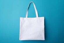 White Tote Bag Without Words Isolated On Blue Background. Mock Up. 