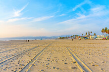 Wide Venice Beach Shoreline Covered With Footprints And Tire Tracks
