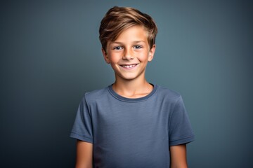 Wall Mural - Three-quarter studio portrait photography of a grinning kid male wearing a casual t-shirt against a minimalist or empty room background. With generative AI technology