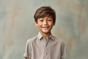 Wall Mural - Environmental portrait photography of a grinning kid male wearing a casual short-sleeve shirt against a minimalist or empty room background. With generative AI technology