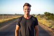 © Markus Schröder - Three-quarter studio portrait photography of a happy boy in his 30s wearing a casual t-shirt against a winding country road background. With generative AI technology