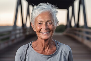 Wall Mural - Editorial portrait photography of a glad old woman wearing a sporty polo shirt against a rustic bridge background. With generative AI technology