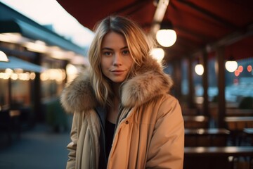 Wall Mural - Medium shot portrait photography of a tender girl in her 30s wearing a warm parka against a lively rooftop bar background. With generative AI technology