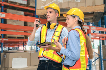 Wall Mural - Caucasian man, woman warehouse supervisor discuss and use tablet check package with forklift driver worker load box on shelf, product distribution inventory management,Logistics shipping business plan