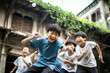 © zakiroff - Chinese boys play football on the backyard in asian city