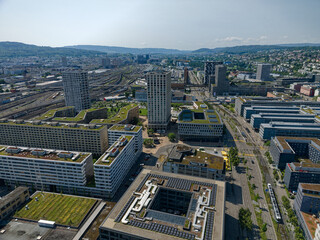 Wall Mural - Aerial view of City of Zürich industrial district with skyline and cityscape on a sunny spring day. Photo taken May 28th, 2023, Zurich, Switzerland.