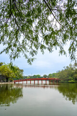 Wall Mural - view of The Huc Red Bridge and Ngoc Son temple in the center of Hoan Kiem Lake, Ha Noi, Vietnam.