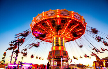 colorful rides and fun at sunset at the south carolina state fair in columbia, sc
