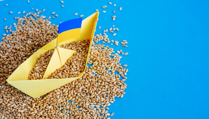 Wall Mural - grain wheat and spikelets on a blue background. Ukraine Russia conflict, Ukrainian ship grain and problem of blockade of ports, grain corridor