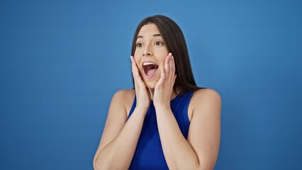 Poster - Young beautiful hispanic woman looking for with winner gesture over isolated blue background