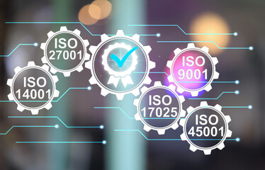 Main ISO standards require for industrial on the blur background such as ISO 27001 for technology information, 17025 laboratory management, 45001 safety in workplace, 14001 environment, 9001 quality