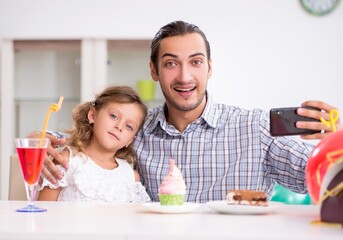 Wall Mural - Father celebrating birthday with his daughter