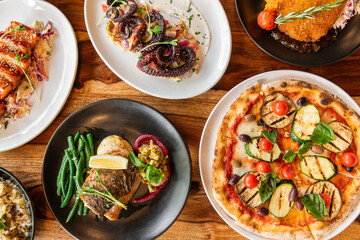 Set of dishes on the table, on a wooden background