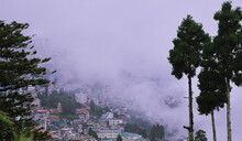 Panoramic View Of Misty And Cloudy Darjeeling Hill Station And Himalaya Mountain Foothills In Monsoon Season, West Bengal In India
