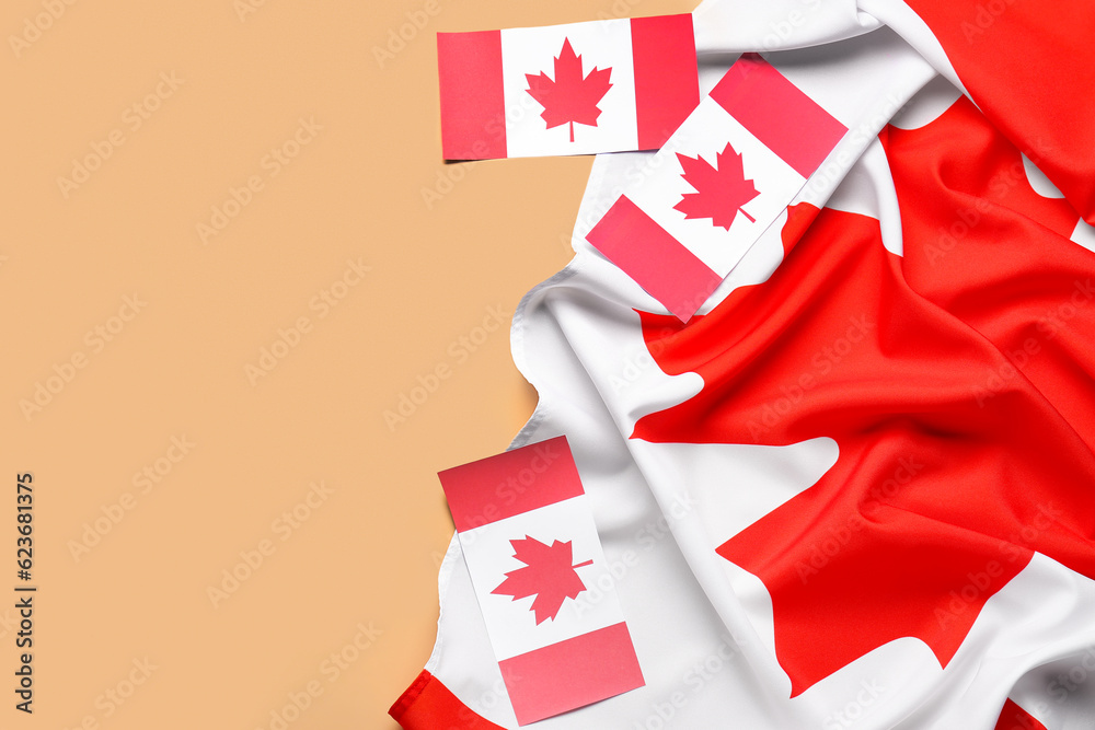 Flags of Canada on orange background