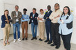 © Lomb - Multiracial Office Team Portrait with Crossed Arms - Full-length portrait of a multiracial office team including junior and senior employees, all standing with crossed arms