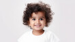 © dwoow - Smiling indian toddler on light background with copy space. Ai generation