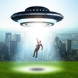 © Elnur - Flying saucer abducting young businessman