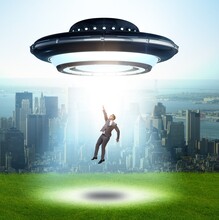 Flying Saucer Abducting Young Businessman