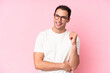 © luismolinero - Young caucasian man isolated on pink background laughing