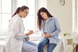 © Studio Romantic - Young woman suffering from stomach ache having consultation with doctor in medical office. Female patient visiting gynecologist, gastroenterologist, therapist or GP in medical clinic