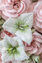 Wall Mural - Zephyr bouquet of flowers in a wicker basket on a light background.