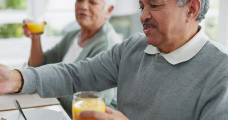 Canvas Print - Senior couple, man and juice at breakfast, table and happy together for start to morning with love, diet and care. Elderly person, woman and glass for smoothie, lunch or healthy drink in house