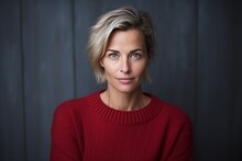 Medium Shot Portrait Photography Of A Serious Russian Woman In Her 40s Wearing A Cozy Sweater Against An Abstract Background 