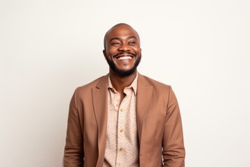 Wall Mural - Portrait of a happy african american man smiling against white background