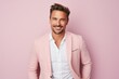 © Anne Schaum - Portrait of a handsome young man in a pink suit smiling at the camera