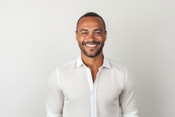 Wall Mural - Portrait of a smiling african american man on white background