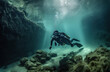 a diver explores a sunken ship on the seabed
