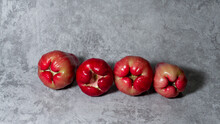 Arranged Red Wax Apple Or Rose Apple (Jambu Air). Isolated On Gray Background.