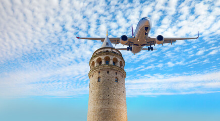 Wall Mural - Commercial  airplane flying over Galata Tower, istanbul