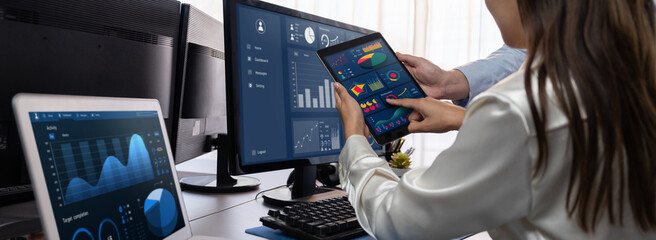 Poster - analyst working on data analysis or bi dashboard on computer monitor. business team analyzing financ