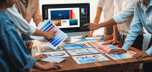 Aufkleber - Graphic designer brainstorming logo and graphic art at busy artistic workshop, laptop display workspace. Experimenting color palette and pattern for creative design. Panorama shot. Scrutinize