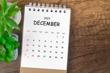The December 2023 Desk Calendar For 2023 On Wooden Background.