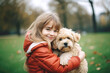 Happy girl smiling hugging dog