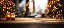 Empty Wooden Table With Christmas Decorations In Front Of A Blurred Background