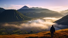 A Man Standing Looking At Bromo Mountain, Indonesia.