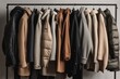 Modern male man neutral colors autumn capsule wardrobe with different coats on grey background. Building stylish wardrobe, Seasonal capsule for easy dressing, order in things concept. Generative AI