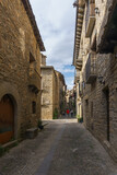 Fototapeta Uliczki - Street with stone houses in the medieval village of Ainsa in the pyrenees, Aragon, Spain